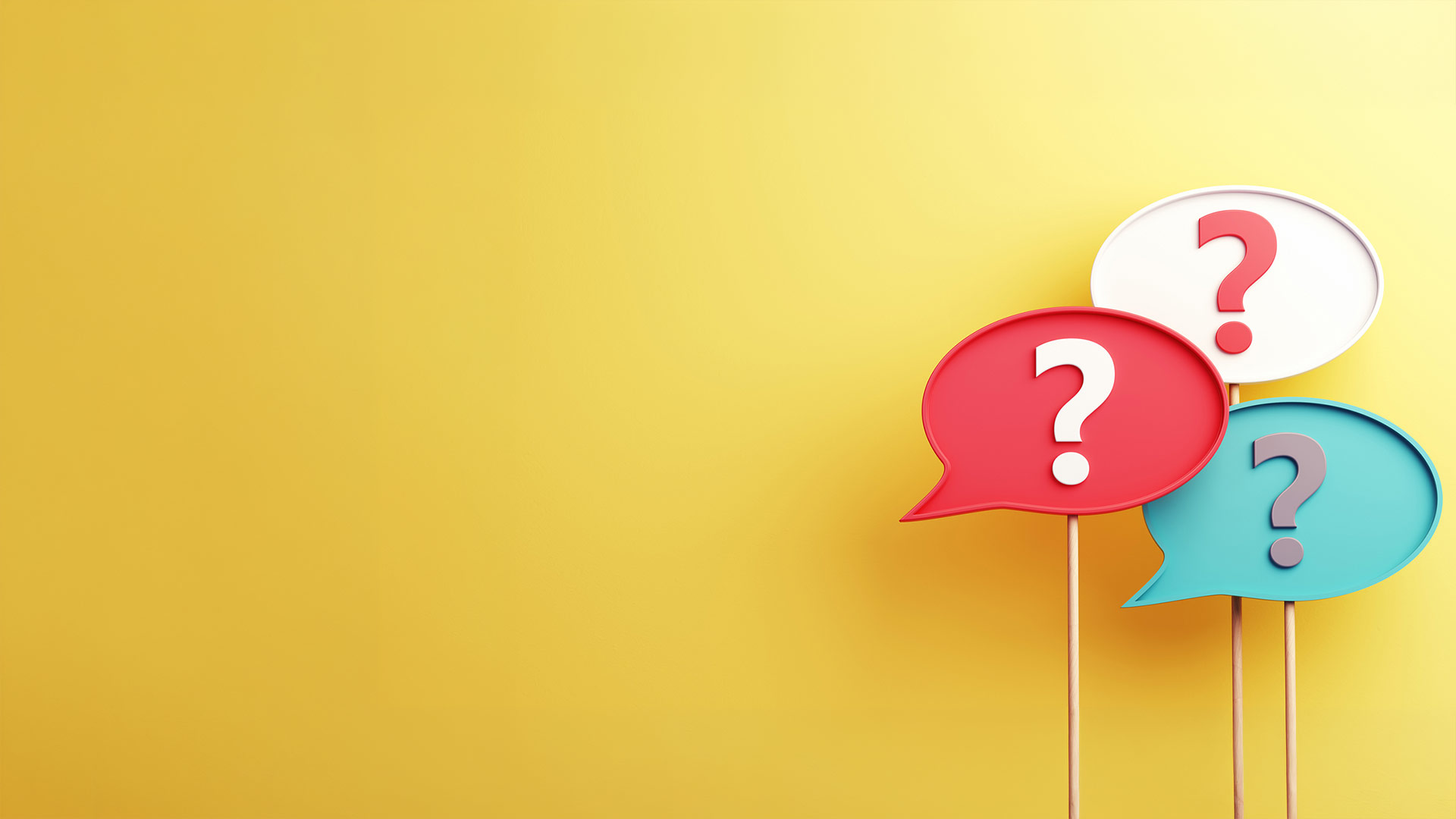 Bulles colorées avec points d’interrogation sur fond jaune – questions fréquentes sur le réseau fibre optique Pully4net à Pully
